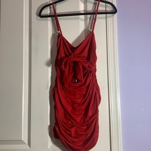 Red mini dress with tie-up cut-out front and side ruching.